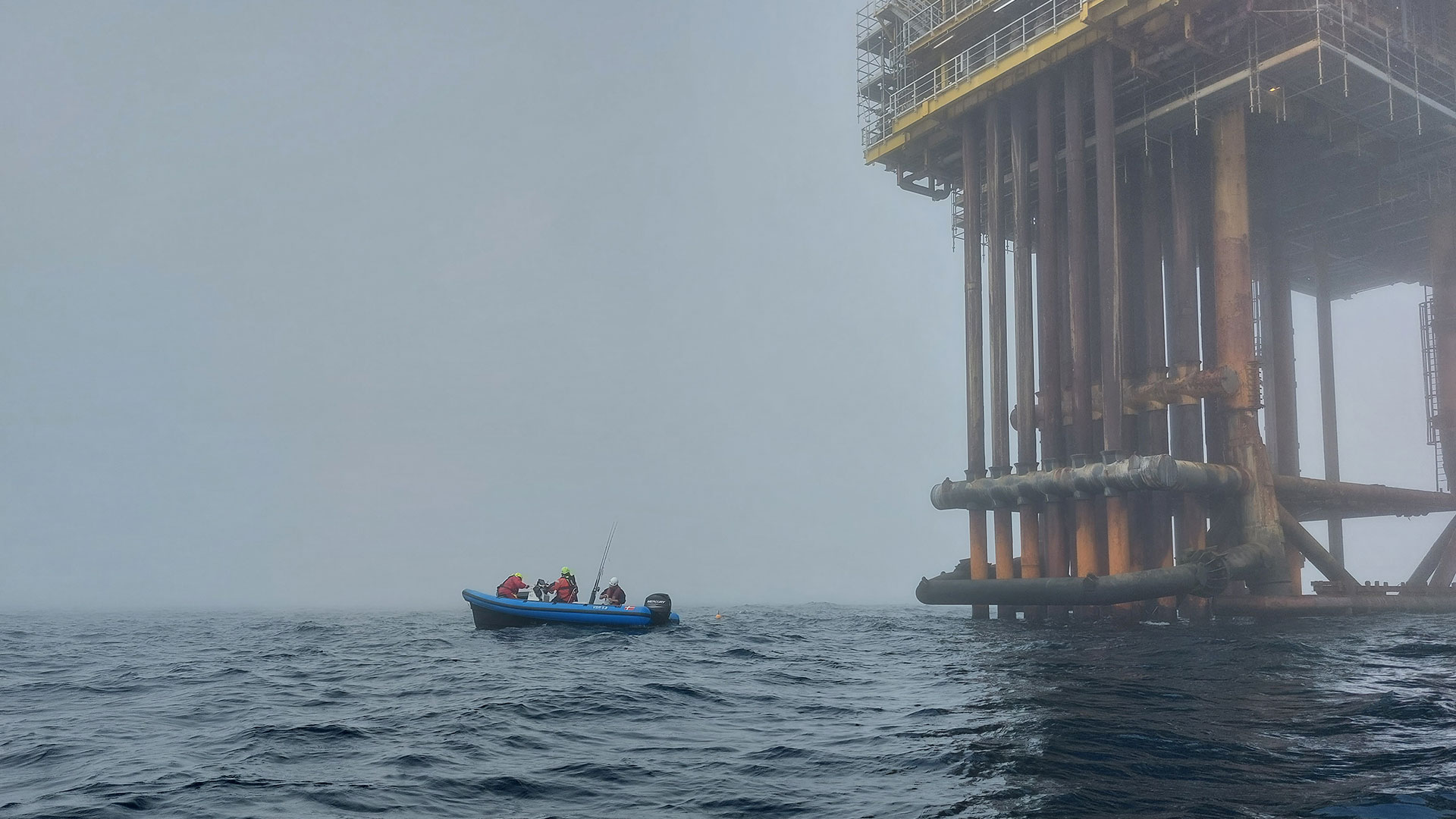 Small boat by offshore platform