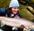 Kim Birnie-Gauvin with an 83 cm large sea trout—ready to be released in Villestrup Å stream after being tagged. Photo Jessica Desforges